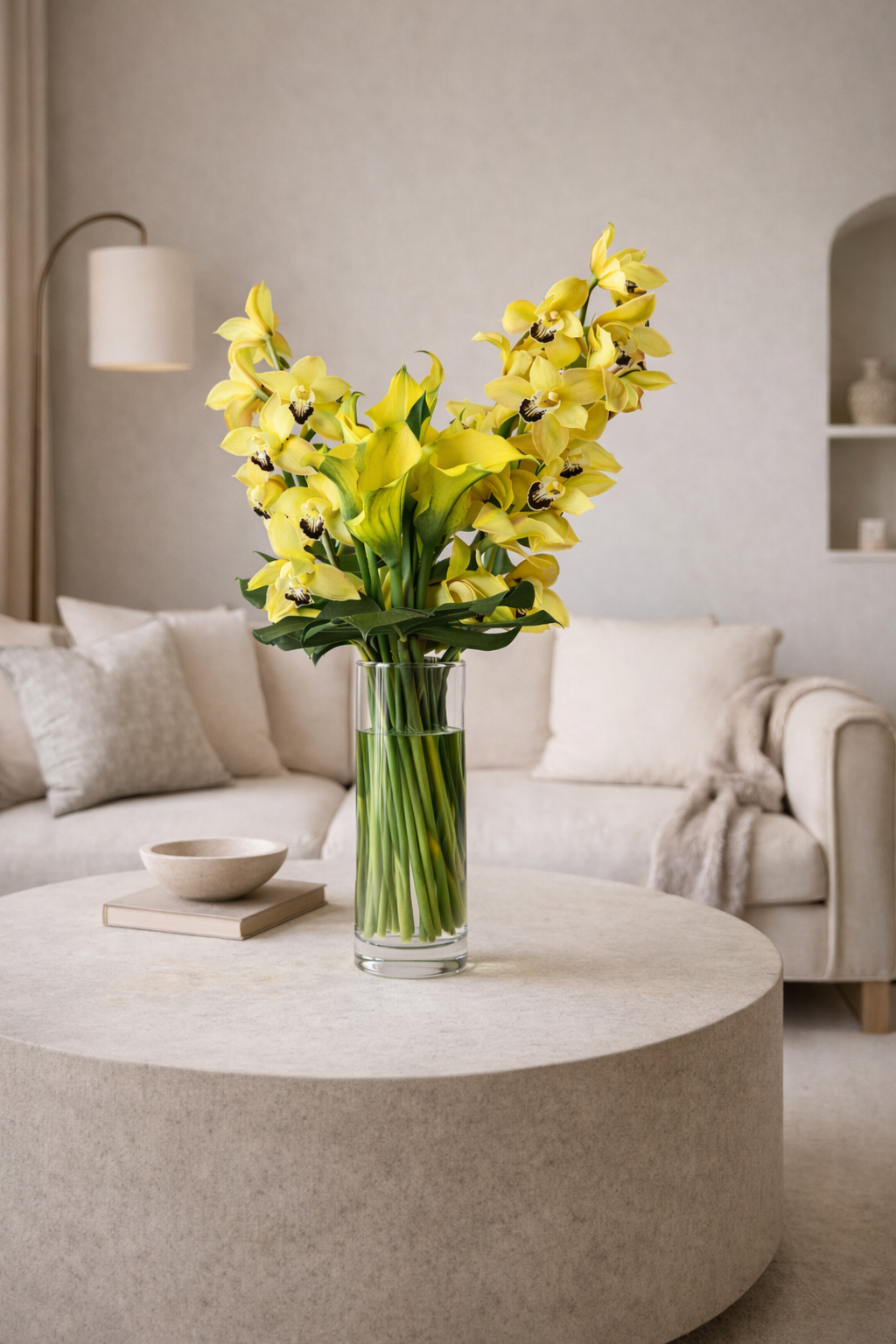 yellow callas lilies and yell0w orchids in a vase for a nice delivery in Montreal