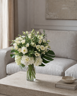 Ivory lisianthus and hydrangea floral arrangement styled in a contemporary interior, created by a Montreal florist