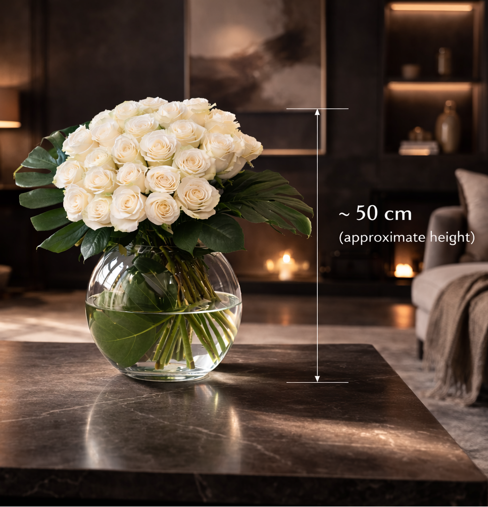 Luxury white roses bouquet approximately 50 cm high in clear glass vase, contemporary dark interior setting, Montreal flower delivery