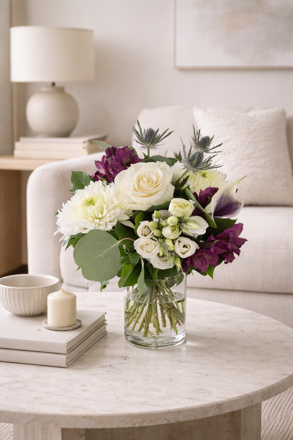 Luxury white and purple flower arrangement in a contemporary interior by a Montreal florist
