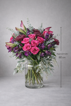 Luxury pink and purple bouquet approximately 60 cm tall in clear vase, Montreal flower delivery.